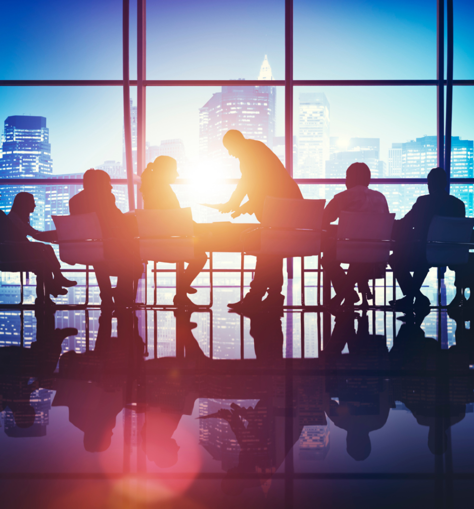 Business structure discussion with silhouetted professionals meeting in a modern office overlooking a city skyline.