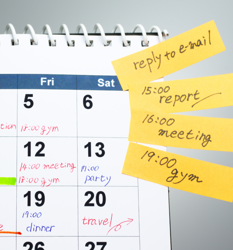 Founder calendar management with a monthly planner, handwritten appointments, and sticky notes showing meetings, reports, and tasks.